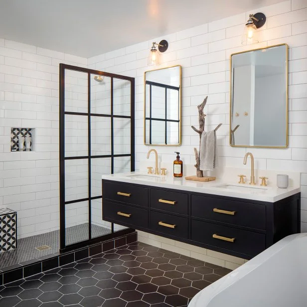 Modern bathroom remodel with black vanity and hexagon tile