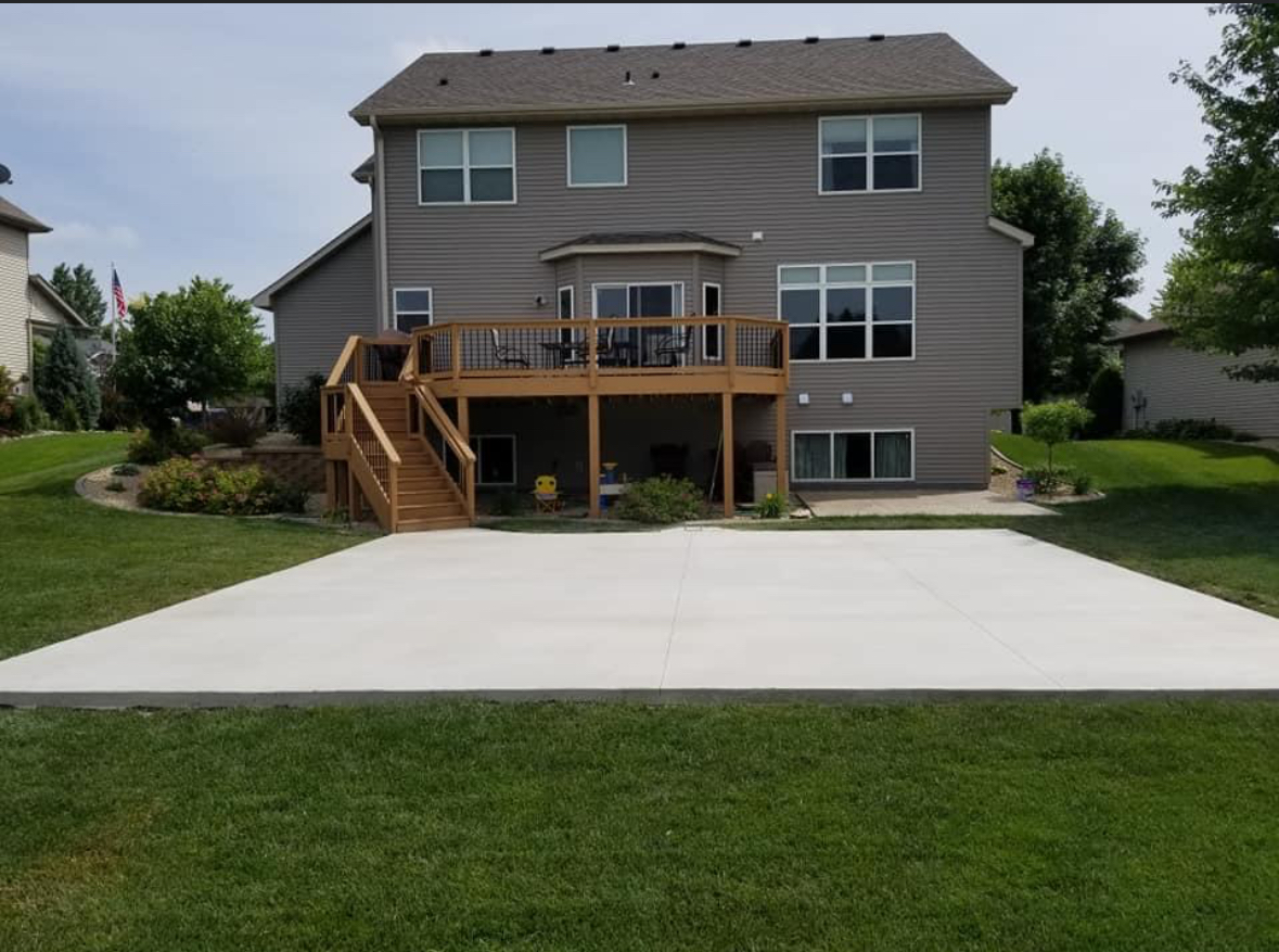 Backyard deck and concrete patio installation